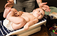 Baby being weighed on scale