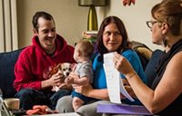 Family with home visiting nurse
