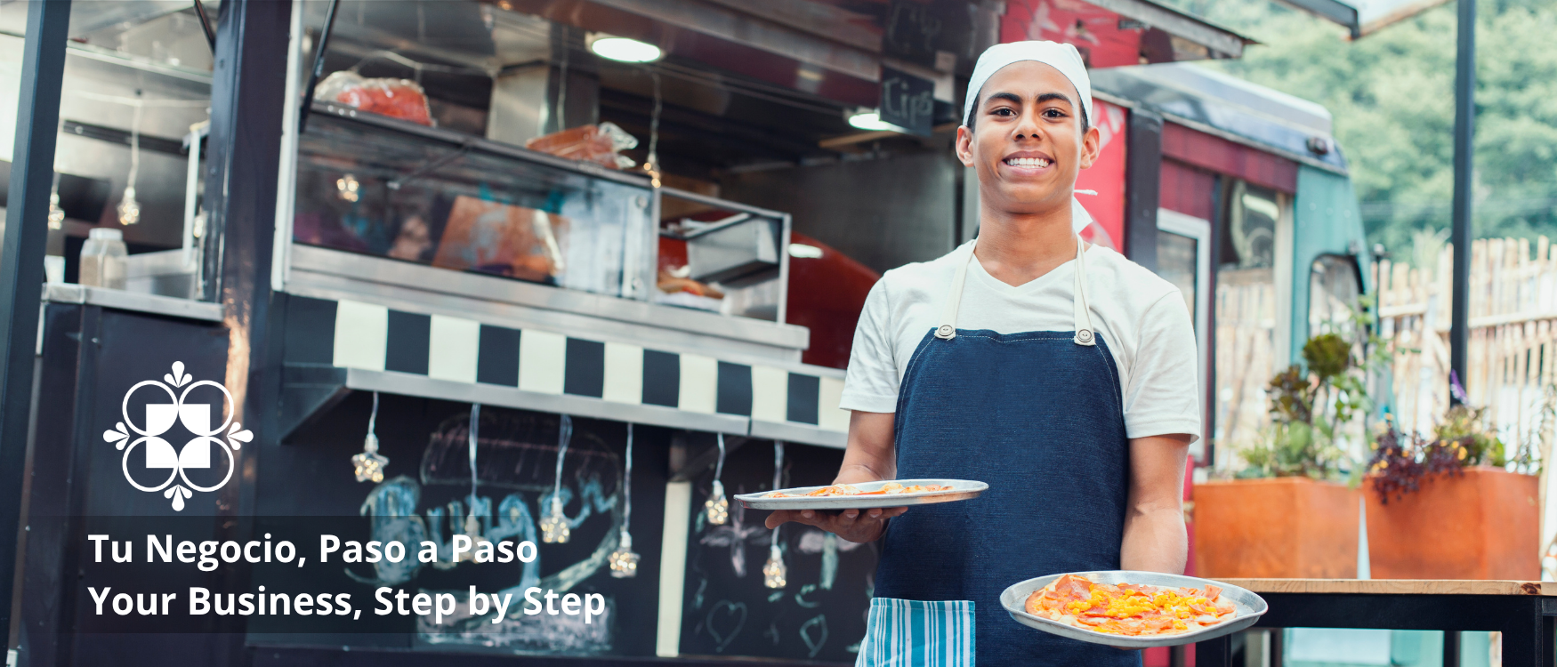 Food truck employee smiling with food and pasos logo
